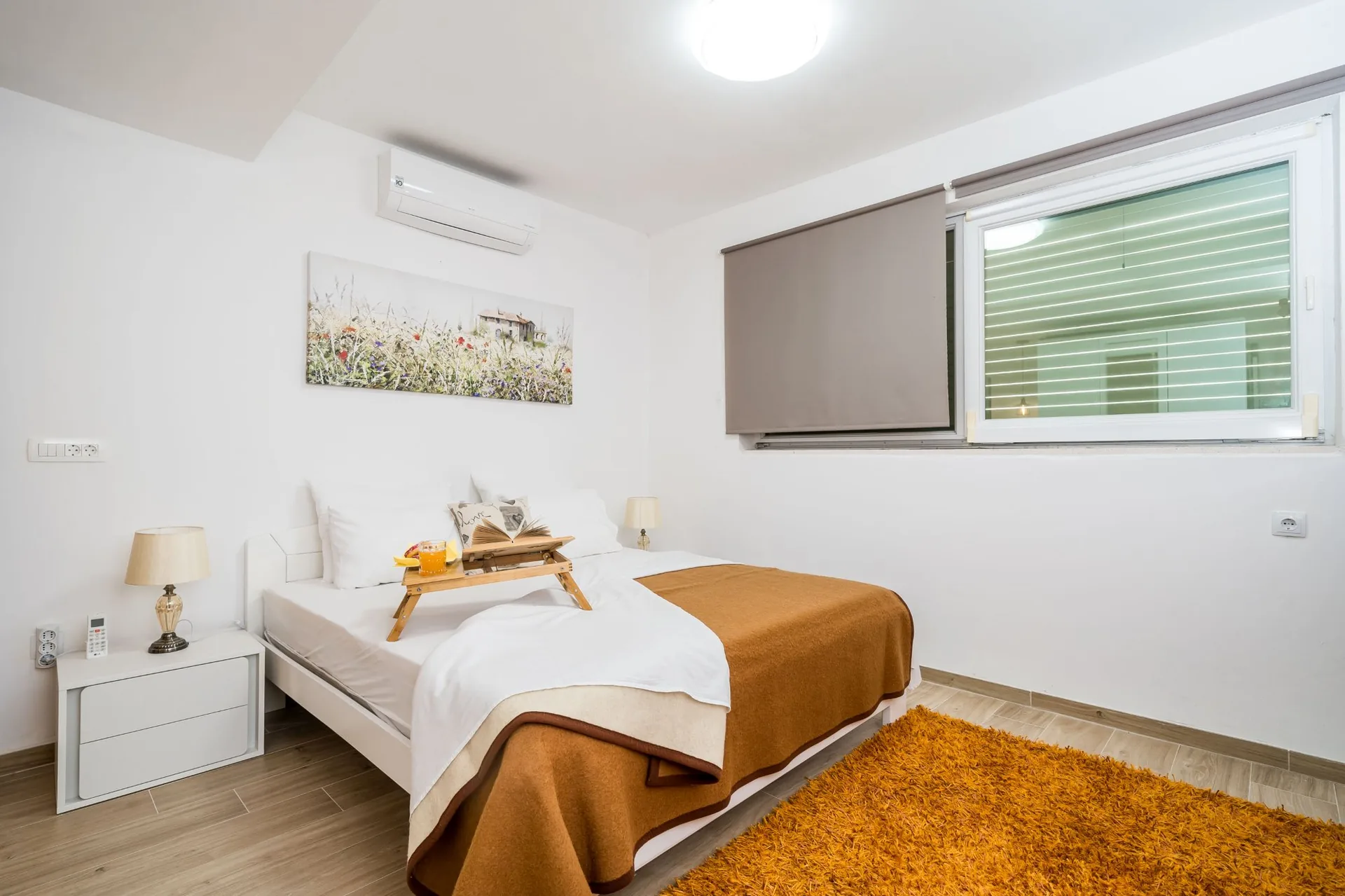 luciana residence bedroom orange rug air conditioning