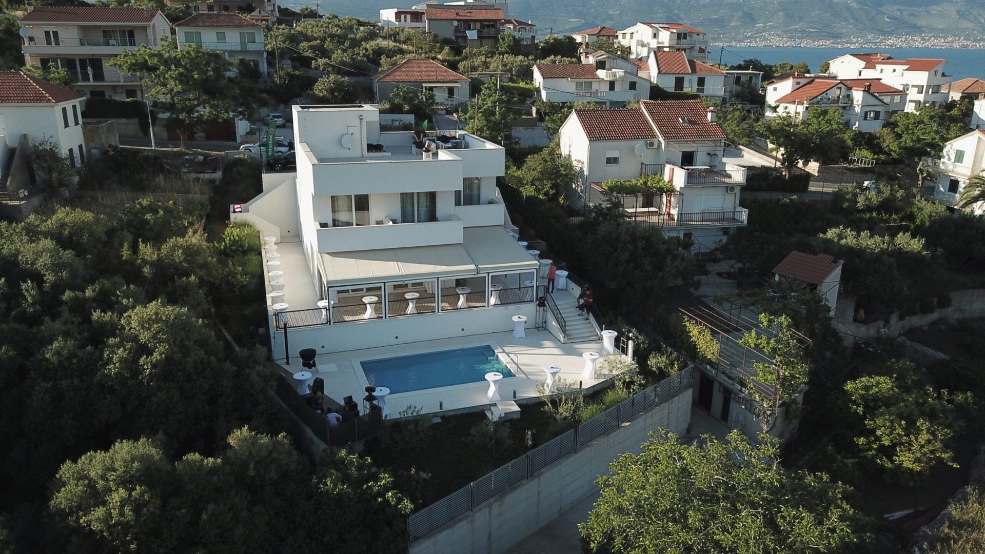 magico apartments aerial view pool terrace day