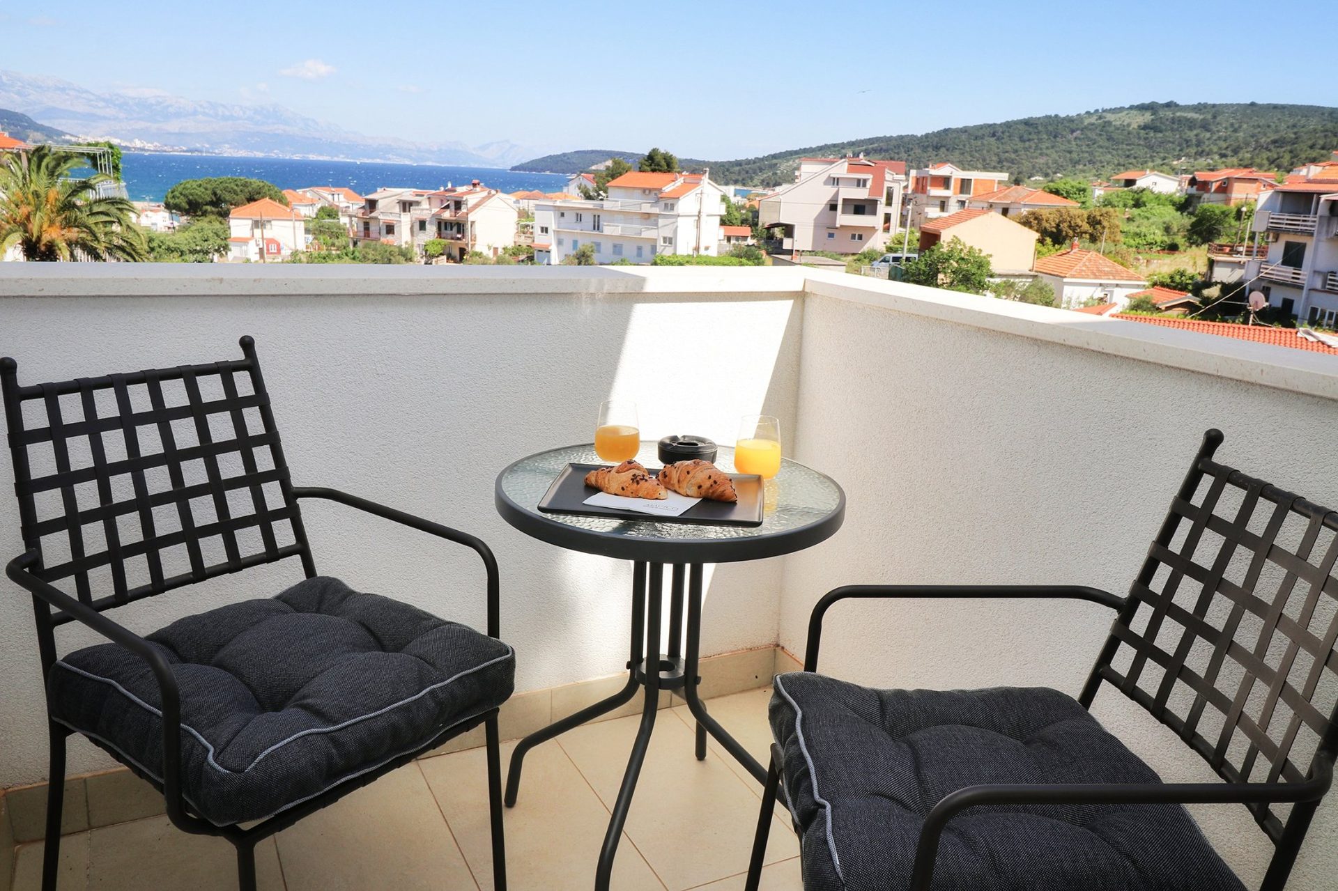 magico apartments balcony sea view orange juice